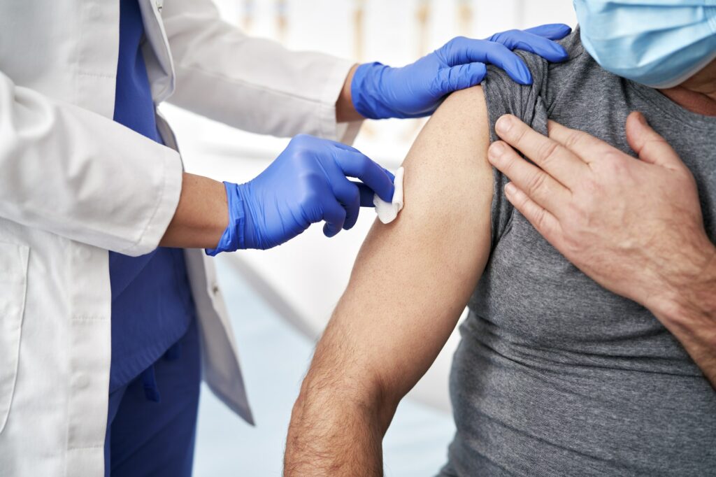 Close up of prepares a patient for vaccination